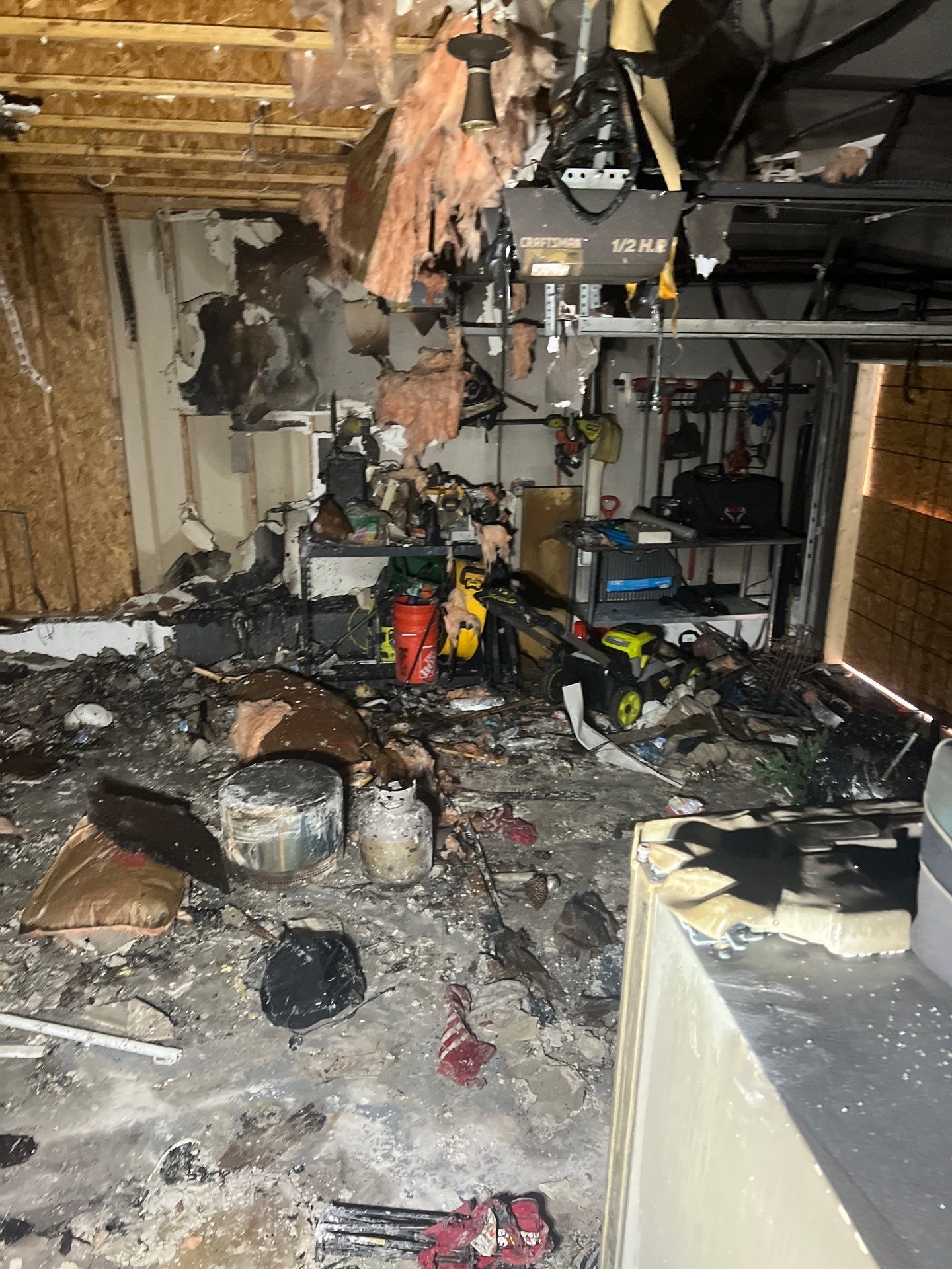 Extensive fire damage inside a Ozark garage cleared by IRS crew