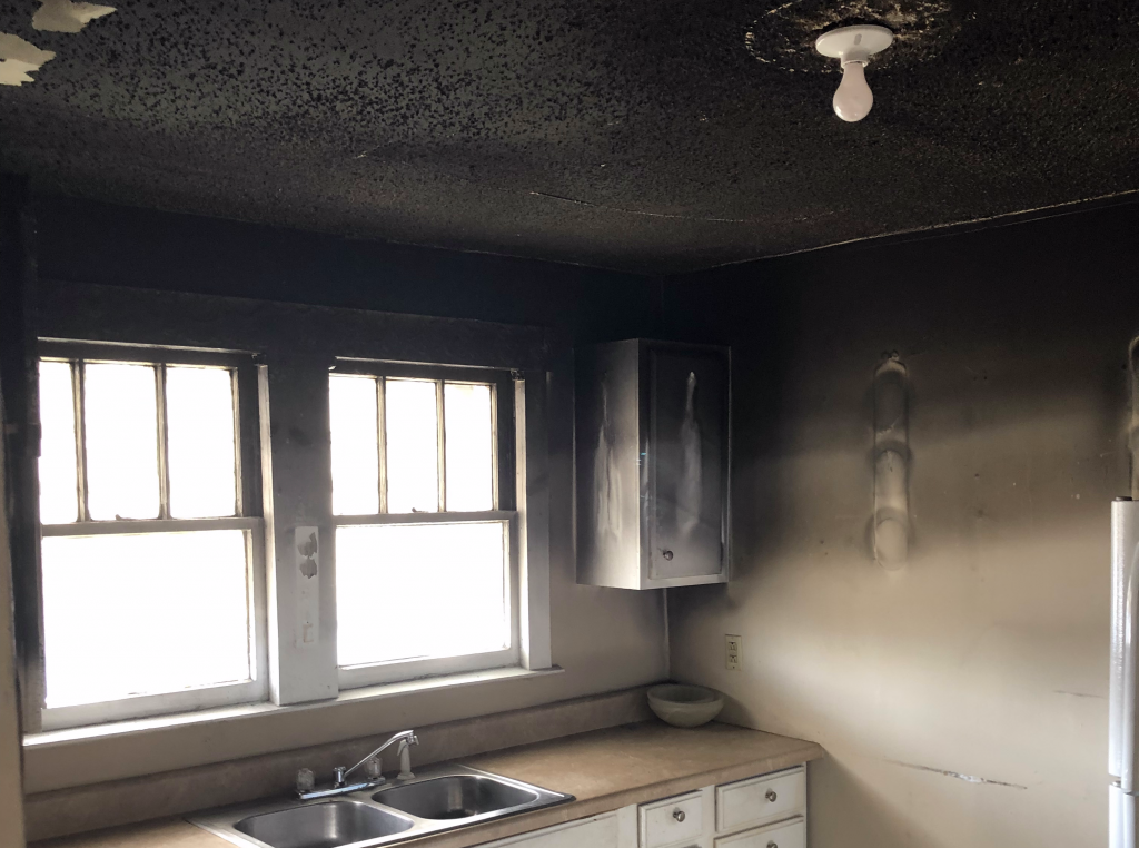 Heavy smoke and soot damage in a Ozark kitchen after a fire