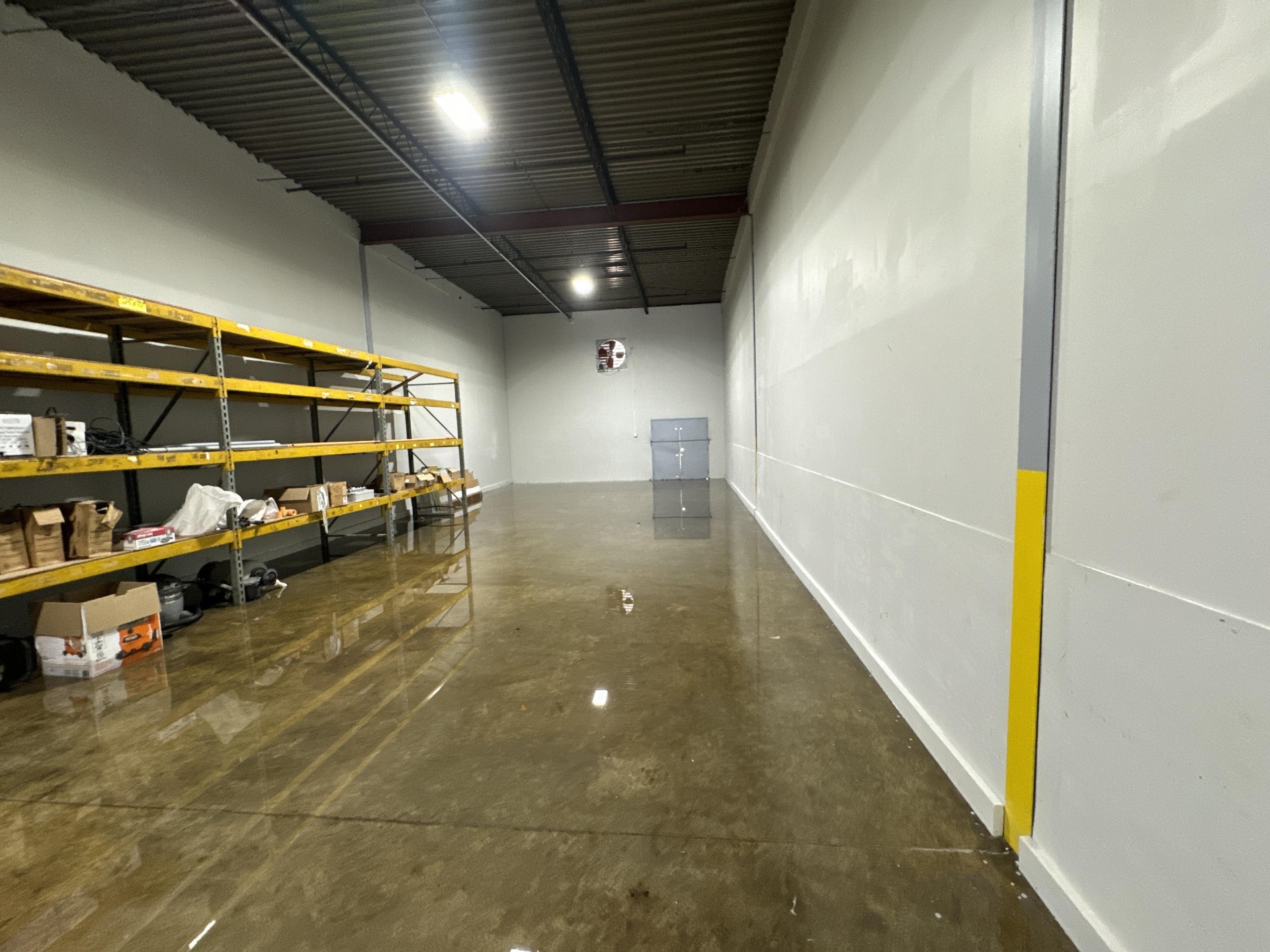 Warehouse shelves flooded after a storm event in Ozark